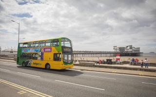 A bus in front of Weston-super-Mare's Grand Pier.