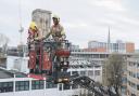 Stock image of Avon firefighters on an aerial ladder platform