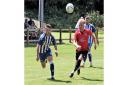 Eyes on the ball from Clevedon Town's Ethan Feltham at Bovey Tracey.