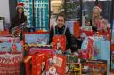 Cambridge Regional College staff Aimee Sibley Wootton, Bethany Chapman and Hannah Harland with some of the presents collected for children in care