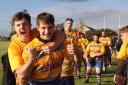 Matt Fisher and Ethan Thomas celebrate Clevedon RFC's win at Midsomer Norton.