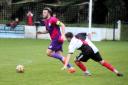 Clevedon Town's Syd Camper gets away from former Seasider under-18s player 18 Dylan Gould.