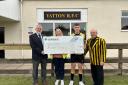 The cheque being presented to the club (L-R: Graham Goodhind, Carly Spear, Finn Skuse, Paul Griffin)