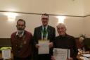 Presentation of long service award to Dennis James by Richard Allen (centre)