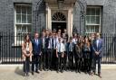 North Somerset MP, Liam Fox stands with Gordano School students outside 10 Downing Street.
