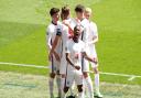 England's Raheem Sterling celebrates scoring their side's first goal of the game with team-mates during the UEFA Euro 2020 Group D match at Wembley Stadium, London. Picture date: Sunday June 13, 2021.