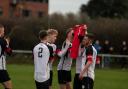 Portishead Town hold aloft a shirt with number five, the number Ollie Hatfield wore during his time with Posset after Ethan Feltham's first goal against Cribbs Reserves,