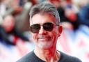 The producers are looking at a comedian to possibly stand in for Simon Cowell.