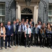 North Somerset MP, Liam Fox stands with Gordano School students outside 10 Downing Street.