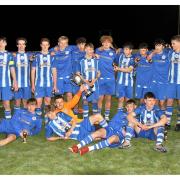 Clevedon Town under-18s celebrate winning the Roger Stone Cup after beating Paulton Rovers under-18s in the final.