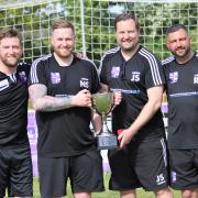 From left to right, Al Parsons (physio), Nic Steadman (manager), Jamie Smith (manager) and Rich Lucas (first team coach) celebrate Nailsea & Tickenham becoming Uhlsport Somerset County League Premier Division champions.