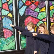 High Down Junior pupils helped decorate the windows of High Street stores.
