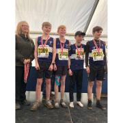 All smiles for North Somerset AC under-13s boys as they pose for the camera with their bronze medals.