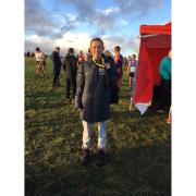 Ellie Wallace proudly displaying the goal medal she won after winning the South West Cross Country Championships Senior Ladies title
