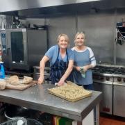 Sam Johnson, left, helped prepare more than 100 Christmas meals for vulnerable families.