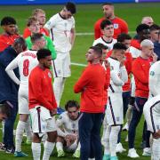 England players stand dejected following the UEFA Euro 2020 Final at Wembley Stadium, London. Picture date: Sunday July 11, 2021.