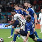 Italy's Giorgio Chiellini (right) tackles England's Raheem Sterling during the UEFA Euro 2020 Final at Wembley Stadium, London. Picture date: Sunday July 11, 2021.