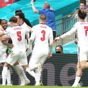 England's Raheem Sterling (left) celebrates scoring their side's first goal of the game during the UEFA Euro 2020 round of 16 match at Wembley Stadium, London. Picture date: Tuesday June 29, 2021.