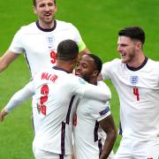 England's Raheem Sterling (centre) celebrates scoring their side's first goal of the game with Kyle Walker (left), Harry Kane and Declan Rice (right) during the UEFA Euro 2020 Group D match at Wembley Stadium, London. Picture date: Tuesday June 22, 2021.