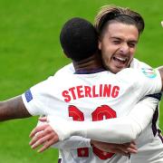 England's Raheem Sterling (left) celebrates scoring their side's first goal of the game with Jack Grealish during the UEFA Euro 2020 Group D match at Wembley Stadium, London. Picture date: Tuesday June 22, 2021.