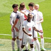 England's Raheem Sterling celebrates scoring their side's first goal of the game with team-mates during the UEFA Euro 2020 Group D match at Wembley Stadium, London. Picture date: Sunday June 13, 2021.