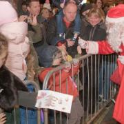 Santa collecting letters and greeting youngters at the Portishead Christmas Lights switch-on.    Picture: MARK ATHERTON