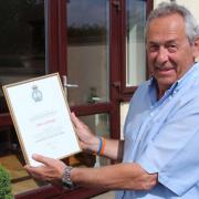 John Gittings with his letter of thanks from the RNLI for his fundraising efforts.