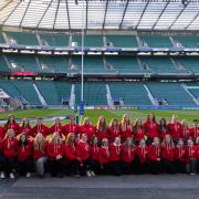 The women rugby refs line up before the England-Japan men's match at Twickenham. Picture: Mark Hayward