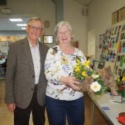 Mike and Ann Ganfield with Anne's March Magic entry which won first prize in the floral art category at a previous edition