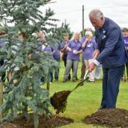 Prince Charles tree planting in the gardens at Penny Brohn UK.