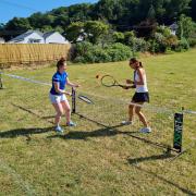 Olivia Wellings and Gemma Hockin setting up for coaching at All Saints School