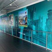 The mural greets all new arrivals.