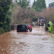 Firefighers assisting a motorist stuck in floodwater in Long Ashton. Picture: Bedminster Fire Station