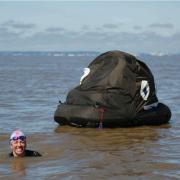 Mermaid Lindsey towed an inflatable poo during her swim across the channel to raise awareness of sewage pollution