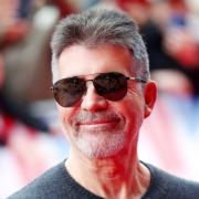 The producers are looking at a comedian to possibly stand in for Simon Cowell.
