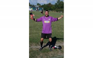 Portishead Town Head of Football turned goalkeeper Dave Hewitt saved two penalties before scoring the winning kick to send Posset into the next round of the FA Vase.
